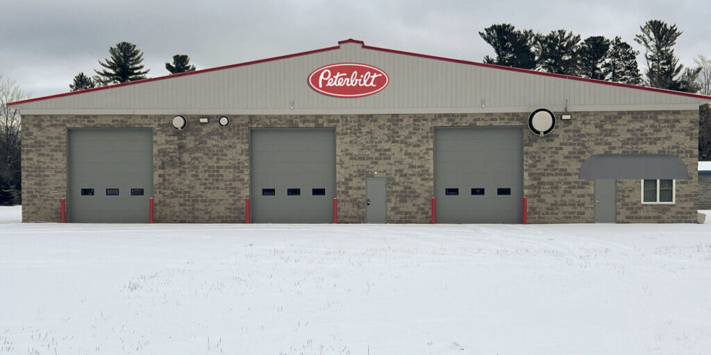 Building-mockup-gray-awning-no-logo-no-scallop-scaled JX Truck Center Marquette Michigan Location Building Photo