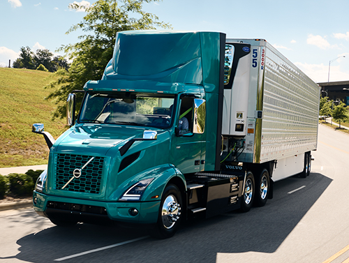 Volvo_VNR_Electric_Highway Teal Volvo VNR Electric Truck on highway